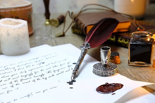 quill pen and inkwell
