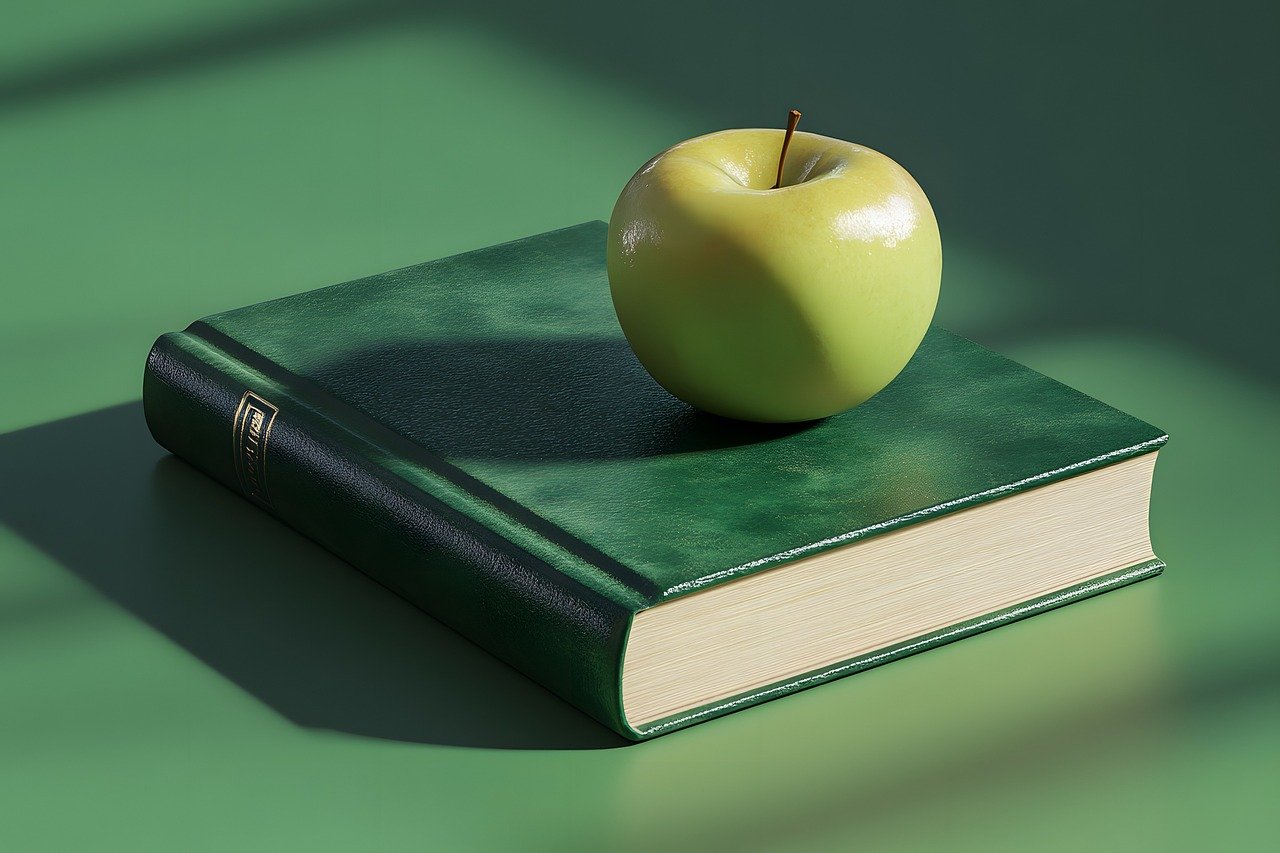 green-apple green apple on a green book